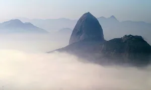 Sugar loaf mountain is seen covered by thick early morning fog in Rio de Janeiro Sugar loaf mountain is seen covered by thick early morning fog in Rio de Janeiro