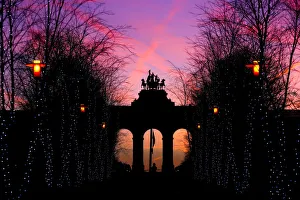The sun rises behind the Cinquantenaire arch in Brussels The sun rises behind the Cinquantenaire arch in Brussels