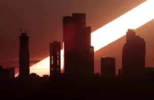The sun rises behind the skyscrapers of the Moscow International Business Centre in The sun rises behind the skyscrapers of the Moscow International Business Centre in