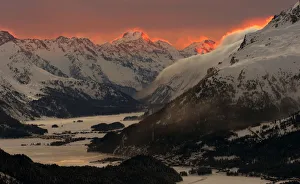 The sunset illuminates the peaks of the mountains near the Swiss mountain resort of St The sunset illuminates the peaks of the mountains near the Swiss mountain resort of St