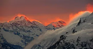 The sunset illuminates the peaks of the mountains near the Swiss mountain resort of St The sunset illuminates the peaks of the mountains near the Swiss mountain resort of St