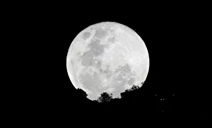 A super moon is pictured next to the Monserrate church in Bogota A super moon is pictured next to the Monserrate church in Bogota