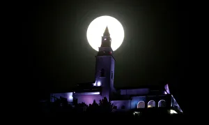 A supermoon is pictured next to the Monserrate church in Bogota A supermoon is pictured next to the Monserrate church in Bogota