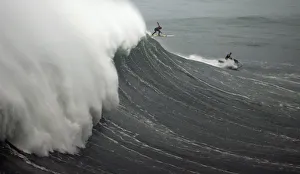 A surfer drops in on a large wave at Praia do Norte, in Nazare A surfer drops in on a large wave at Praia do Norte, in Nazare