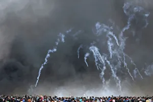 Tear gas canisters are fired by Israeli troops at Palestinian demonstrators during Tear gas canisters are fired by Israeli troops at Palestinian demonstrators during