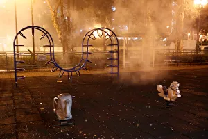 Tear gas is seen at a childrens playground outside a police station in Shatin Tear gas is seen at a childrens playground outside a police station in Shatin