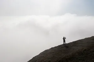A tourist stands on the Ai-Petri peak outside Yalta A tourist stands on the Ai-Petri peak outside Yalta