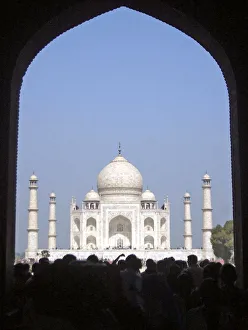 Tourists stand in front of the Taj Mahal in Agra Tourists stand in front of the Taj Mahal in Agra