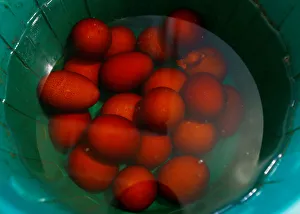 Traditional eggs are cooled in a bucket on the eve of Orthodox Easter in the town of Traditional eggs are cooled in a bucket on the eve of Orthodox Easter in the town of