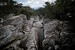 A trail is seen near the Abyss Waterfall at Chapada dos Veadeiros National Park in Alto A trail is seen near the Abyss Waterfall at Chapada dos Veadeiros National Park in Alto