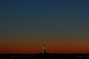 A triple conjunction of the planets Venus, Jupiter and Mercury is seen in the sky over A triple conjunction of the planets Venus, Jupiter and Mercury is seen in the sky over