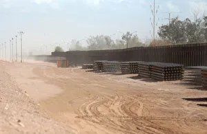 View of the 30-foot high bollard style wall at US-Mexico border to replace a section near View of the 30-foot high bollard style wall at US-Mexico border to replace a section near