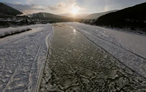 A view shows the Mana River, during an autumn ice drift at sunset A view shows the Mana River, during an autumn ice drift at sunset