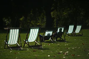 Visitors enjoy the autumn sunshine as they sit in deck chairs in St James Park, central Visitors enjoy the autumn sunshine as they sit in deck chairs in St James Park, central