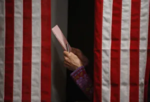 A voter checks her ballot in the Ballot Room of the Balsams Hotel in Dixville Notch A voter checks her ballot in the Ballot Room of the Balsams Hotel in Dixville Notch