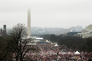 The top of the Washington Monument is shrouded in clouds as people pack the National Mall The top of the Washington Monument is shrouded in clouds as people pack the National Mall