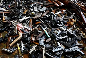 Weapons and drugs are displayed prior to their destruction in a melting nickel plant near Weapons and drugs are displayed prior to their destruction in a melting nickel plant near