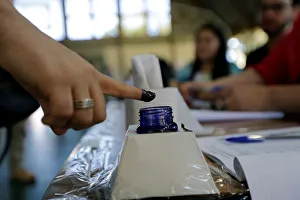 A woman inks his finger before casting her vote during elections in Asuncion A woman inks his finger before casting her vote during elections in Asuncion