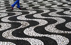 A woman walks over patterned paving in central Porto Alegre during the 2014 World A woman walks over patterned paving in central Porto Alegre during the 2014 World
