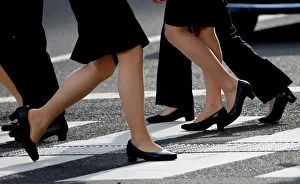 Women in high heels walk at a business district in Tokyo Women in high heels walk at a business district in Tokyo