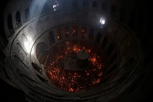 Worshippers hold candles as they take part in the Christian Orthodox Holy Fire ceremony Worshippers hold candles as they take part in the Christian Orthodox Holy Fire ceremony