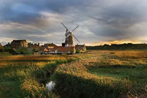 Reedbed and Cley Mill at Cley North Norfolk on a stormy evening in October Reedbed and Cley Mill at Cley North Norfolk on a stormy evening in October