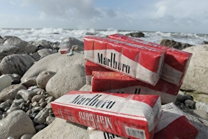 Prints of Cigarettes washed up on beach after container spill, Isle of Portland, Dorset, England, February 2014 Images Dated 2014 July: Cigarette Print, Isle of Portland Beach Spill