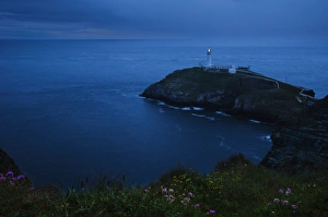 Welsh Coastline Photography Prints: View of coastline and lighthouse at dusk, South Stack Lighthouse, Holyhead, Holy Island