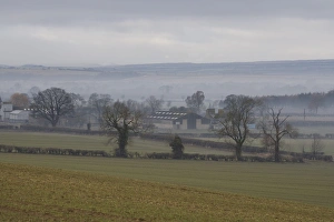 English Countryside Scenery Photos Prints: View of mist over fields and farm buildings
