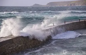 Sennen Cove Prints: Waves breaking over harbour wall
