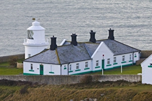 Dorset England Landmarks Prints: White painted lighthouse on coast