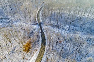Aerial view of forest and road after snowfall in winter Stephen A Aerial view of forest and road after snowfall in winter Stephen A