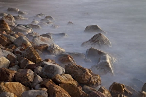 Africa, South Africa, Cape Town. Rocks and waves on Llandudno Beach at sunset Africa, South Africa, Cape Town. Rocks and waves on Llandudno Beach at sunset
