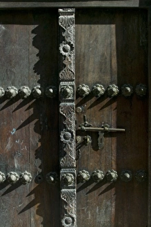 Africa, Tanzania, Zanzibar, Stone Town, Morning sun lights elaborately carved wooden Africa, Tanzania, Zanzibar, Stone Town, Morning sun lights elaborately carved wooden