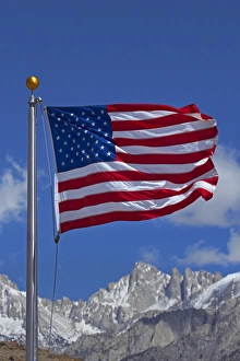American flag and snow on Sierra Nevada Mountain Range, California, USA American flag and snow on Sierra Nevada Mountain Range, California, USA