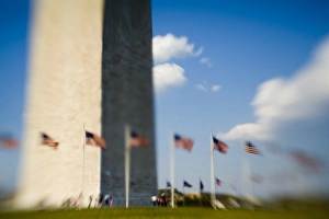 American flags next to Washington Monument (blurred), Washington D.C American flags next to Washington Monument (blurred), Washington D.C