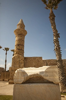 Archeological finds and a restored tower grace the waterfront of ancient Caesarea, Israel Archeological finds and a restored tower grace the waterfront of ancient Caesarea, Israel