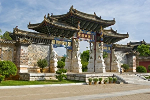 Asia, China, Yunnan Province, Jianshui. Little boy at one of four ornate gates at Asia, China, Yunnan Province, Jianshui. Little boy at one of four ornate gates at