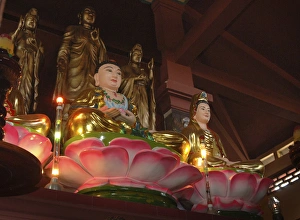 Asia, Vietnam. Buddhas sitting on lotus flowers, Chau Doc, Sam Mountain Asia, Vietnam. Buddhas sitting on lotus flowers, Chau Doc, Sam Mountain