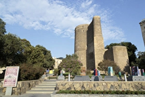 Azerbaijan, Baku. The Maiden Tower in Baku, with artistic representations of it in front Azerbaijan, Baku. The Maiden Tower in Baku, with artistic representations of it in front