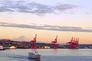 Bainbridge Ferry with Shipping Cranes and Mt. Rainier at Dusk, Seattle, Washington Bainbridge Ferry with Shipping Cranes and Mt. Rainier at Dusk, Seattle, Washington