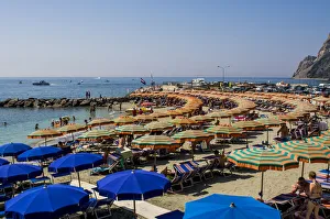 Beach umbrellas lining the beach in Monterosso al Mare, Cinque Terre, Italy Beach umbrellas lining the beach in Monterosso al Mare, Cinque Terre, Italy