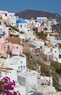 Beautiful Oia in Greek Island of Santorini Greece and the white buildings looking Beautiful Oia in Greek Island of Santorini Greece and the white buildings looking