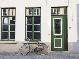 Belgium, Brugge. A bike against a brick wall in Bruges Belgium, Brugge. A bike against a brick wall in Bruges