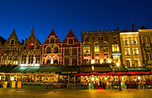 Belgium night photo of colorful cafes in Marketplace in downtown Bruges Belgium Belgium night photo of colorful cafes in Marketplace in downtown Bruges Belgium