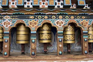 Bhutan, Paro, capital of Paro District aka Dzongkhag. Traditional prayer wheels Bhutan, Paro, capital of Paro District aka Dzongkhag. Traditional prayer wheels