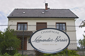 A big sign saying Champagne larmandier-Bernier, wine grower since 1849 A big sign saying Champagne larmandier-Bernier, wine grower since 1849