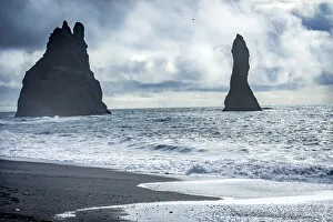 Black sand beach, South Shore, Iceland. Sand is black obsidian Black sand beach, South Shore, Iceland. Sand is black obsidian