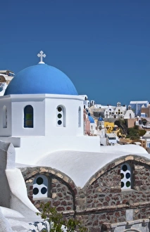 Blue domb church of beautiful Oia in Greek Island of Santorini Greece on cliffs Blue domb church of beautiful Oia in Greek Island of Santorini Greece on cliffs