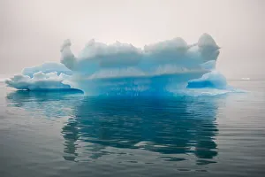 Blue iceberg in the fjord of Narsarsuaq, Greenland Blue iceberg in the fjord of Narsarsuaq, Greenland